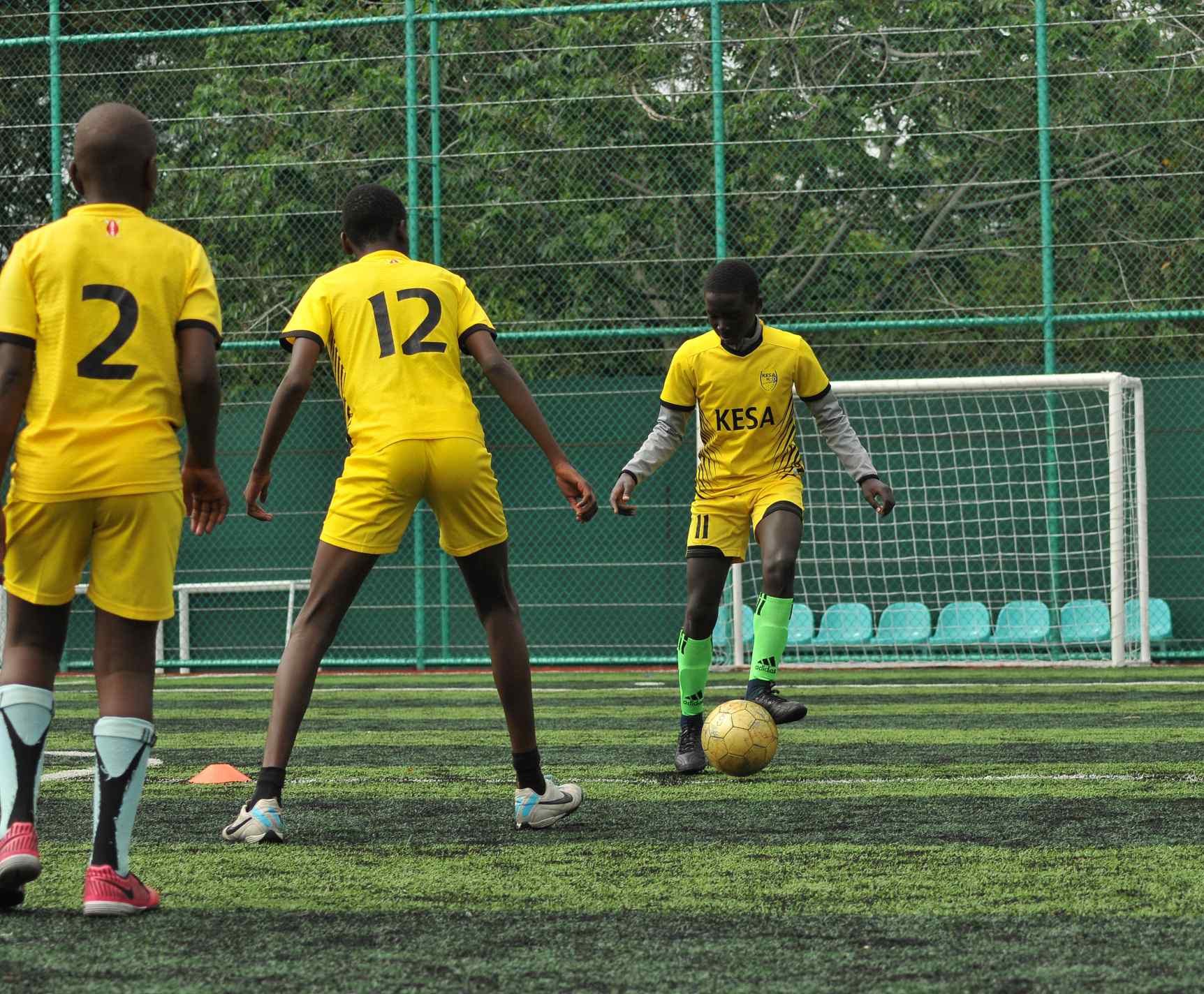Young KESA players in a dribbling drill at the academy in Nairobi