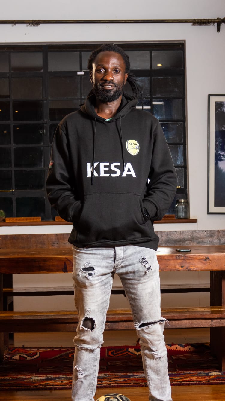 Calvin Owiti, founder and head coach of KESA Academy, in a KESA hoodie